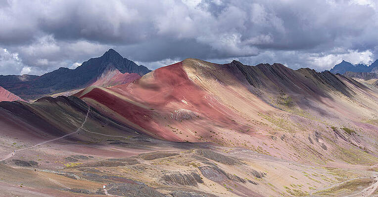 Sky Wall Art featuring the photograph Rainbow Mountain Range Under Cloudy Skies by Brandon Wichmann