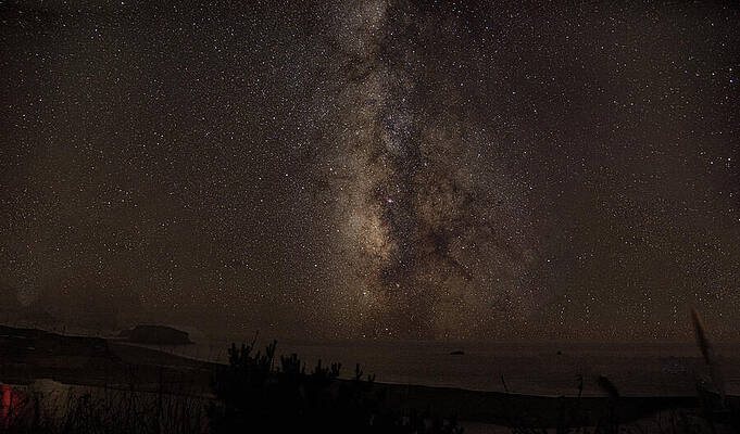 Sky Wall Art featuring the photograph Milky Way Over Tranquil Shoreline by Brandon Wichmann