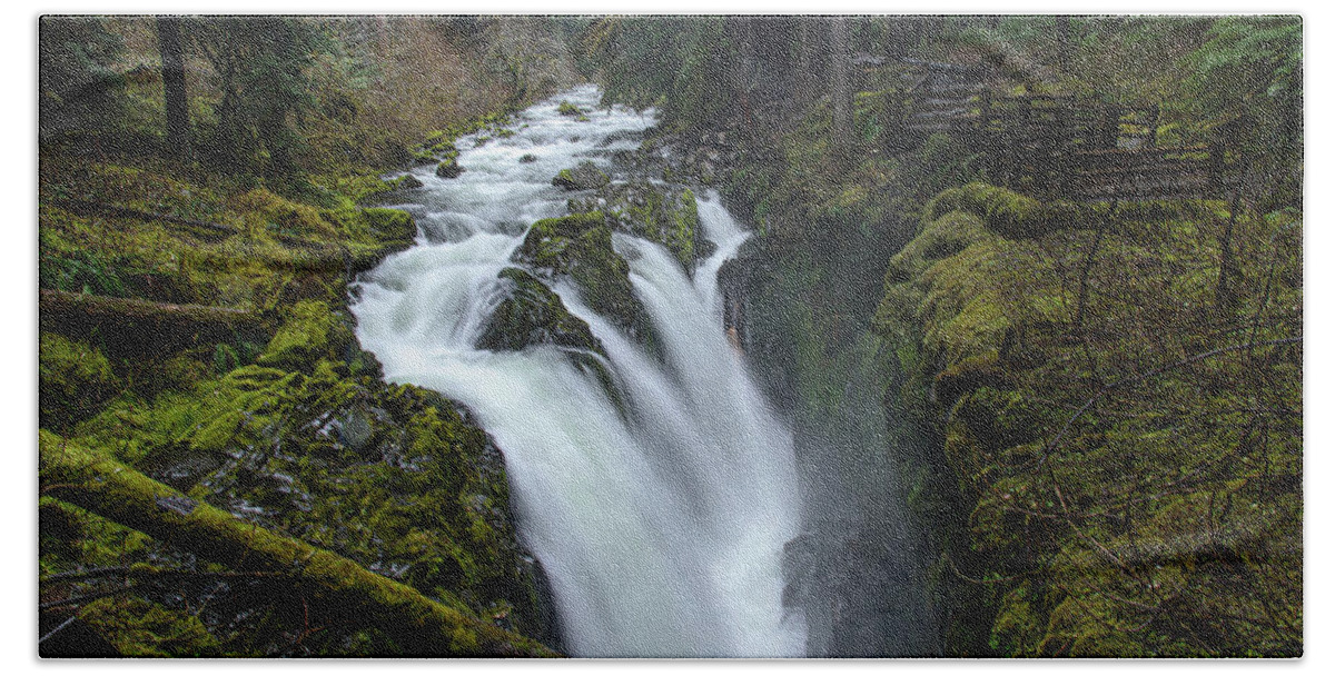Serene Flow Through Mossy Forest Hand Towel