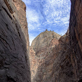 Towering Canyon Cliffs and Blue Sky