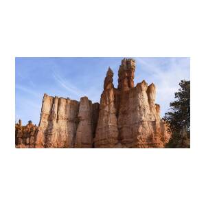 Majestic Rock Formations Under Blue Sky in Bryce Canyon National Park by Brandon Wichmann