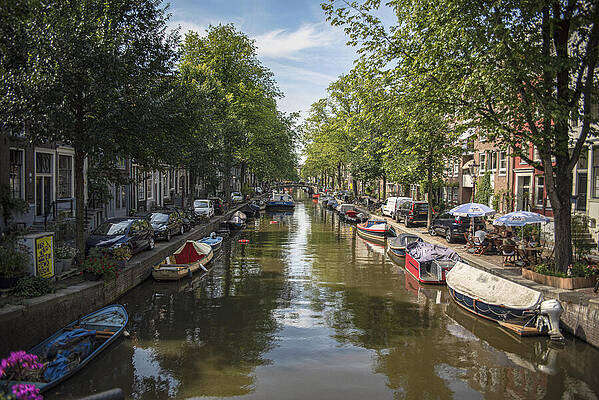 Photograph - Serene Amsterdam Canal With Boats And Trees by Brandon Wichmann