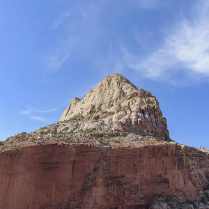 Majestic Mountain Peak Under Blue Sky by Brandon Wichmann