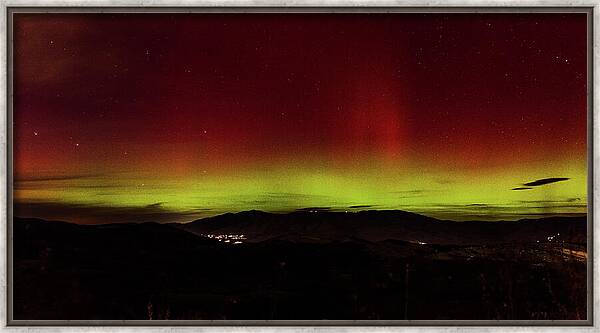 Northern Lights Over Mountain Range Framed Print