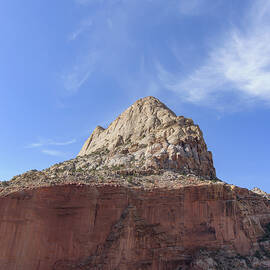 Majestic Mountain Peak Under Blue Sky by Brandon Wichmann