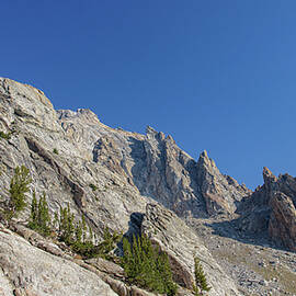 Majestic Mountain Peaks Under Blue Sky by Brandon Wichmann