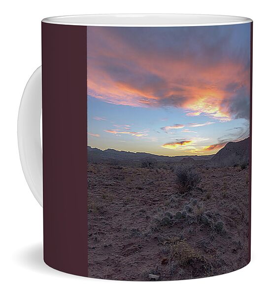 Desert Sunset Over Rugged Terrain Coffee Mug