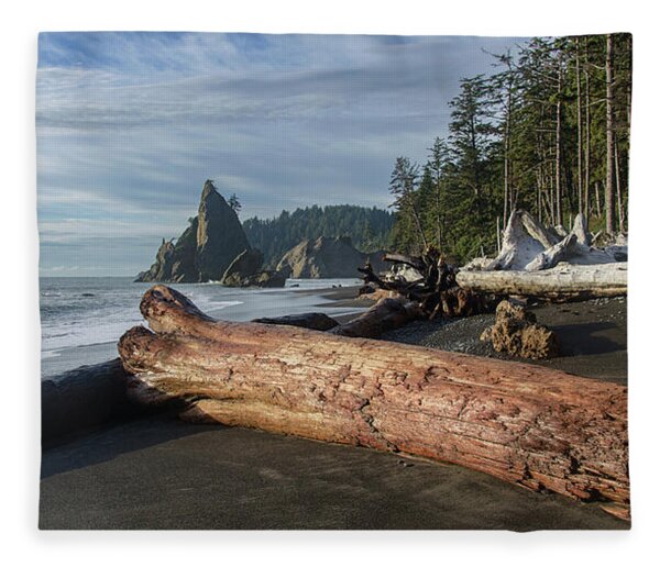 Driftwood on a Pebbled Beach Fleece Blanket