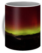 Northern Lights Over Mountain Range Coffee Mug