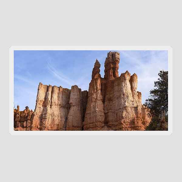 Majestic Rock Formations Under Blue Sky In Bryce Canyon National Park Sticker