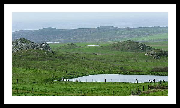 Tranquil Green Hills And Distant Sea Framed Print