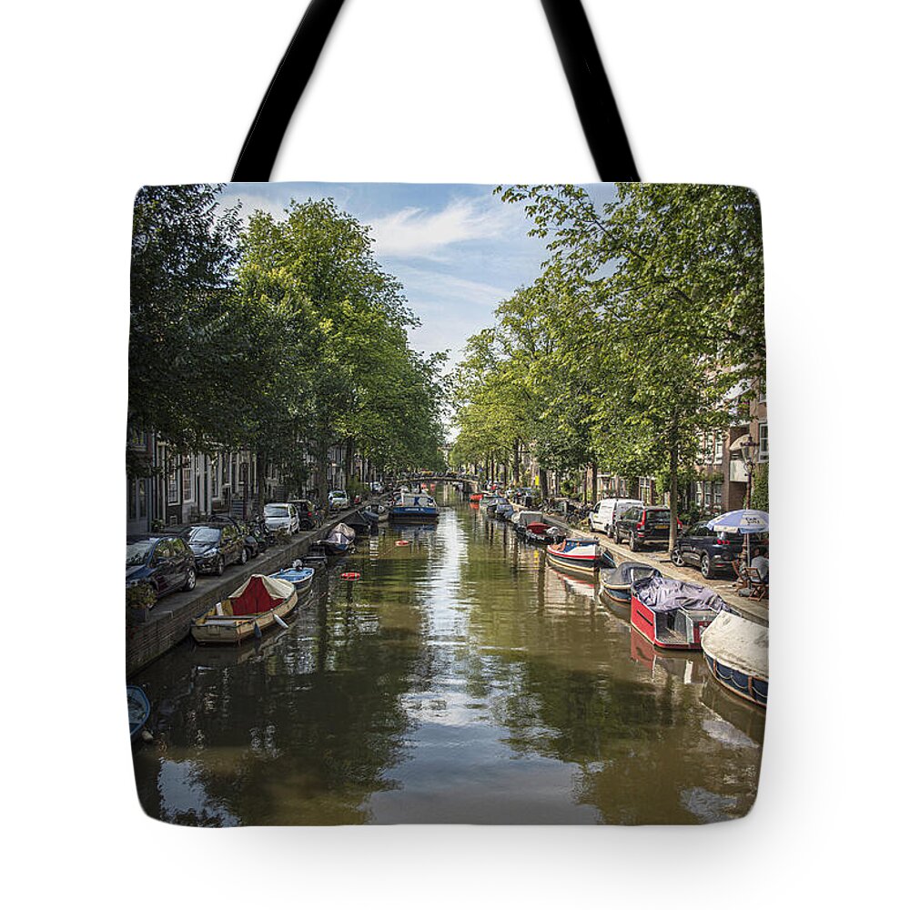 Serene Amsterdam Canal With Boats And Trees Tote Bag