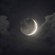 Shimmering Crescent Among Clouds Poster