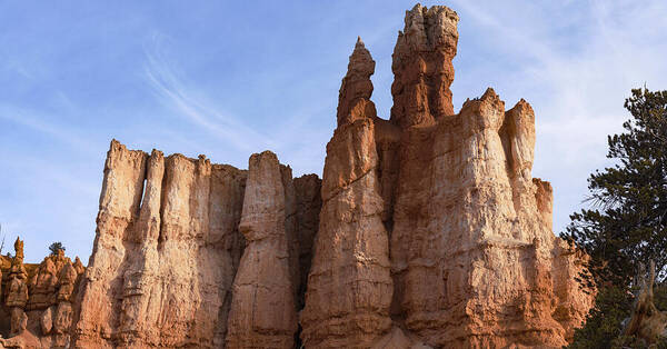 Majestic Rock Formations Under Blue Sky In Bryce Canyon National Park Art Print