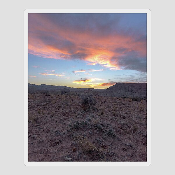 Desert Sunset Over Rugged Terrain Sticker