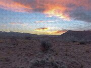 Desert Sunset Over Rugged Terrain Jigsaw Puzzle