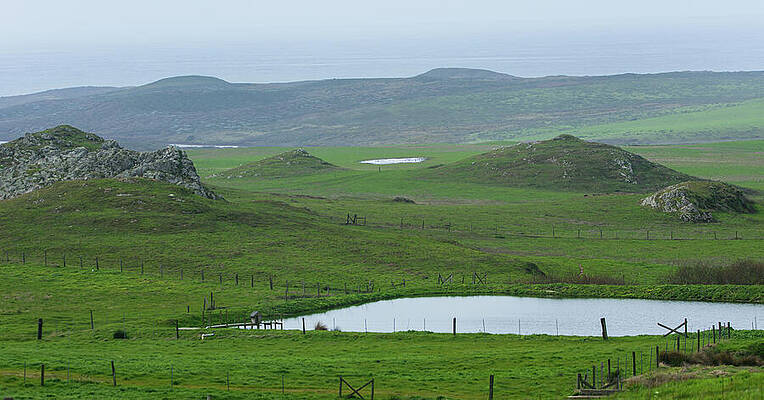 Photograph - Tranquil Green Hills And Distant Sea by Brandon Wichmann