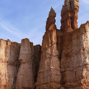 Majestic Rock Formations Under Blue Sky in Bryce Canyon National Park by Brandon Wichmann