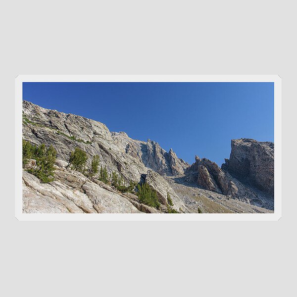 Majestic Mountain Peaks Under Blue Sky Sticker