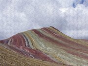 Colorful Mountain Range Under Cloudy Sky Jigsaw Puzzle