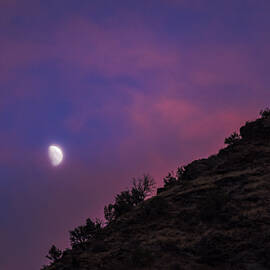 Moonlit Evening Over Silhouetted Hills by Brandon Wichmann