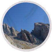 Majestic Mountain Peaks Under Blue Sky Round Beach Towel