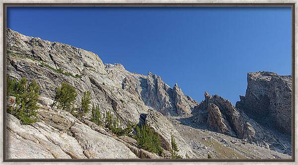 Majestic Mountain Peaks Under Blue Sky Framed Print