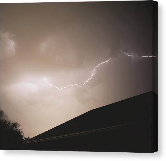 Lightning Illuminates Night Sky Canvas Art Print by Brandon Wichmann