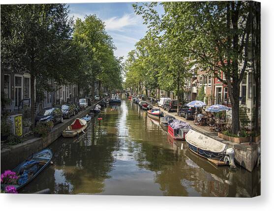 Serene Amsterdam Canal with Boats and Trees Canvas Art Print by Brandon Wichmann