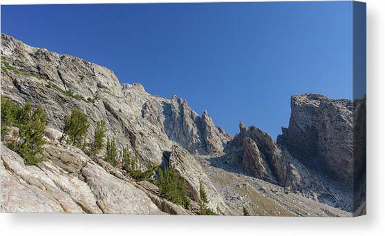 Majestic Mountain Peaks Under Blue Sky Canvas Art Print by Brandon Wichmann