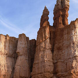 Majestic Rock Formations Under Blue Sky in Bryce Canyon National Park by Brandon Wichmann