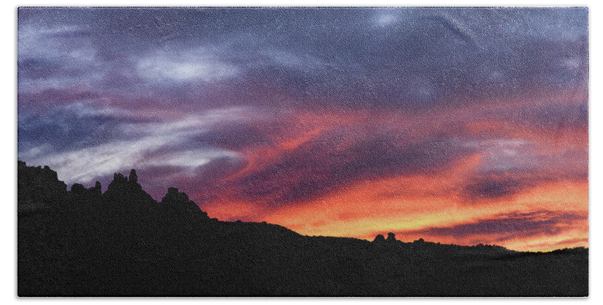 Vivid Twilight over Rocky Silhouette Hand Towel