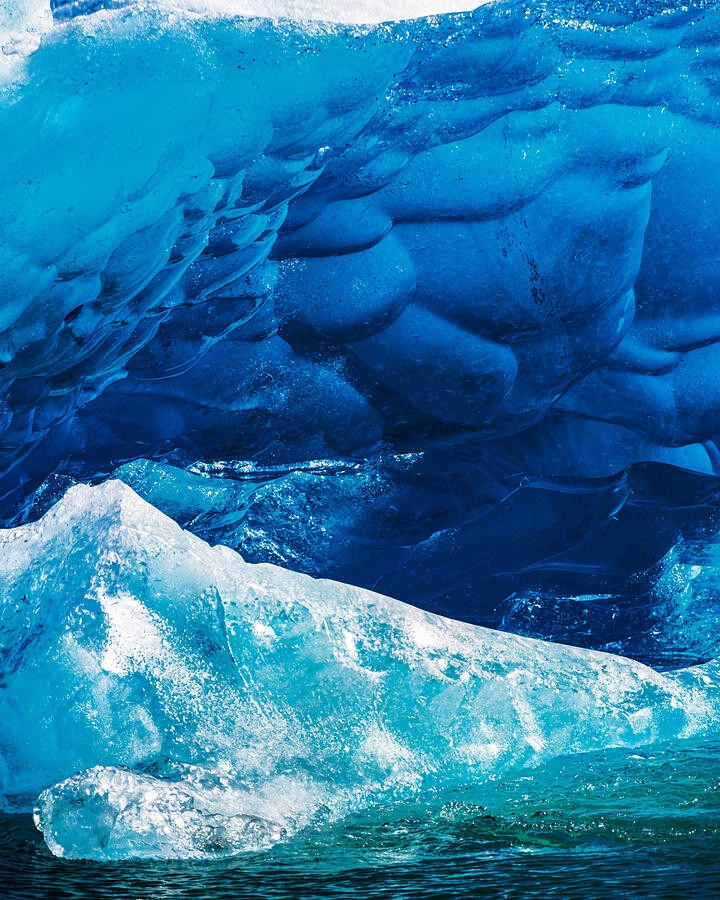 Deep Blue Ice Above Clear Water