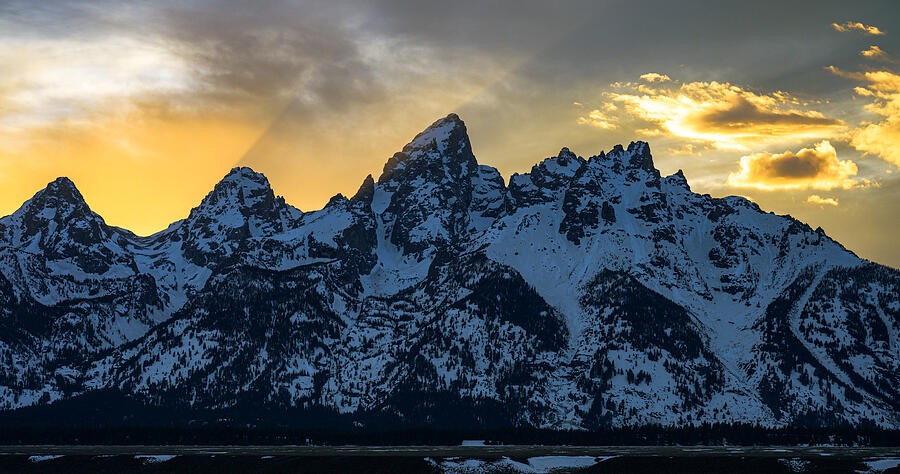 Golden Light Behind the Jagged Peaks
