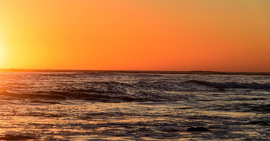 Orange Light Across the Open Ocean