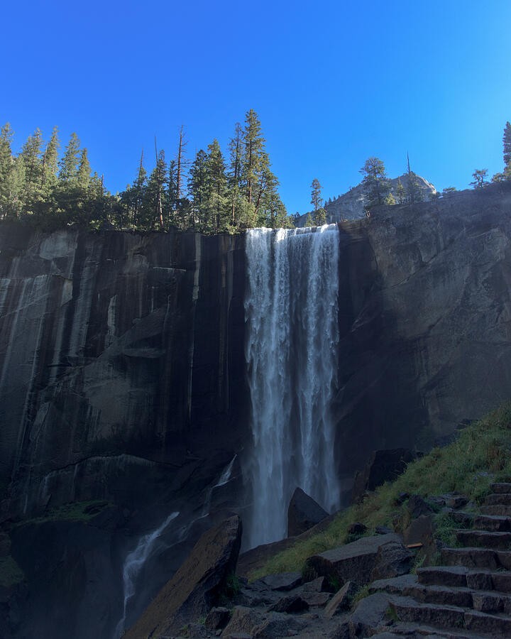 A White Waterfall Below the Granite Rim