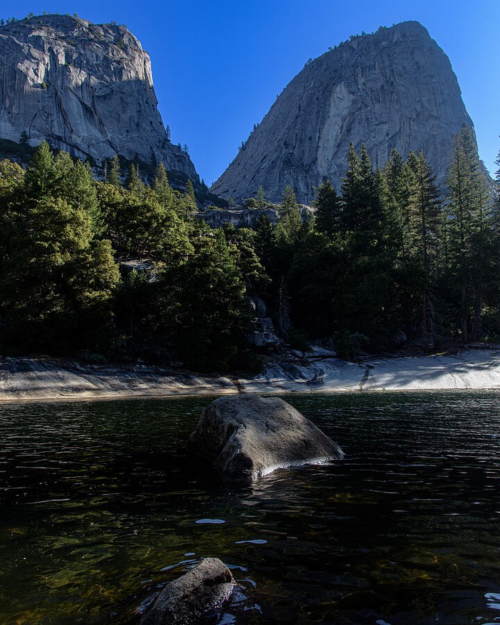 A Still Pool Beneath the Granite Peaks