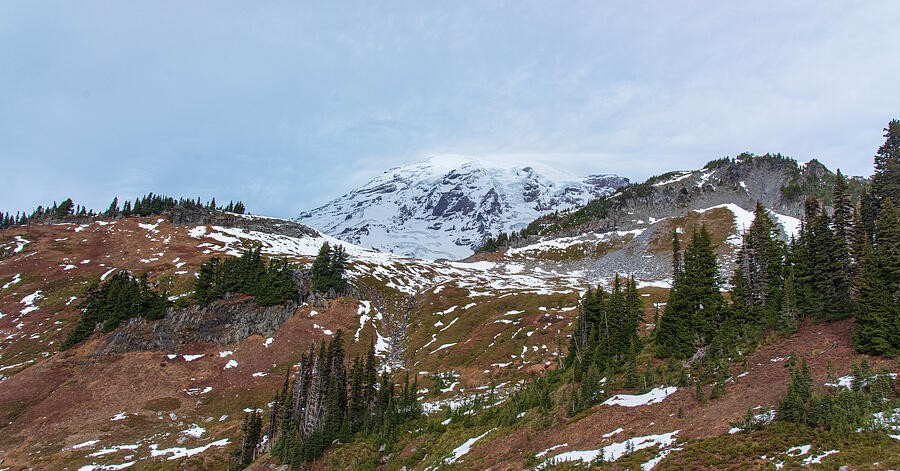 Snow Patches Across the Autumn Hillside