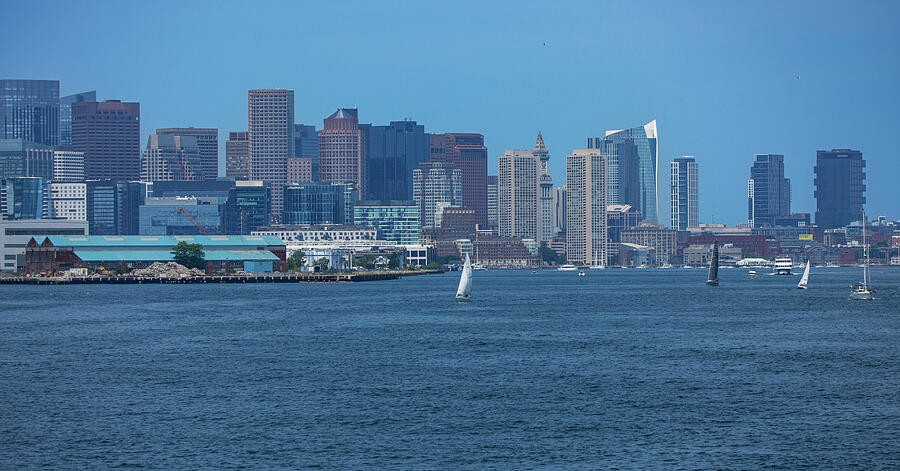 Sails and Buildings Along the Harbor