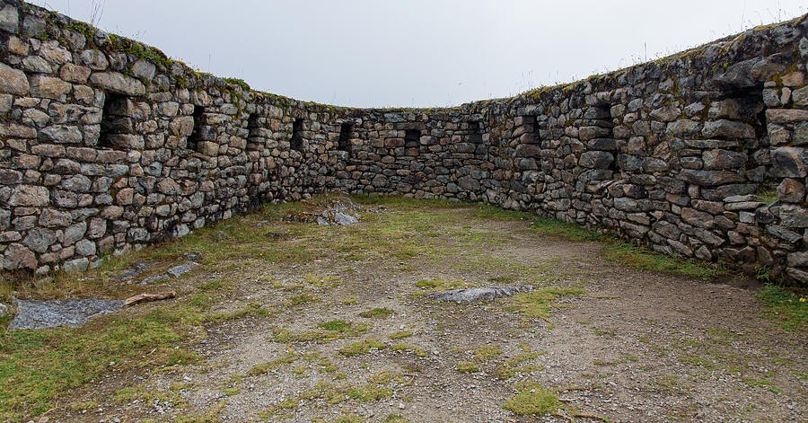 An Open Courtyard Enclosed by Stone Walls