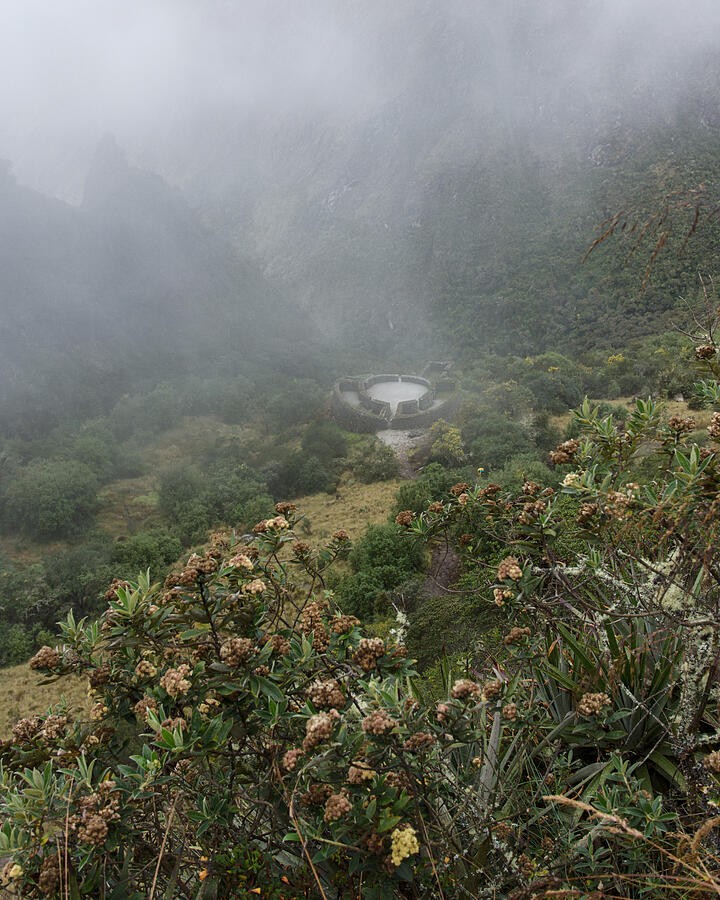 A Circular Stone Ruin Beneath the Drifting Mist
