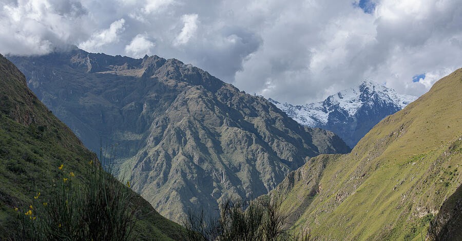 Sunlit Ridges Below the Heavy Mountain Clouds
