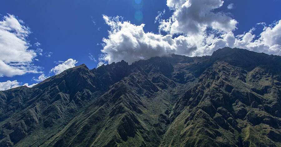 A Dark Mountain Crest Beneath the Billowing Clouds