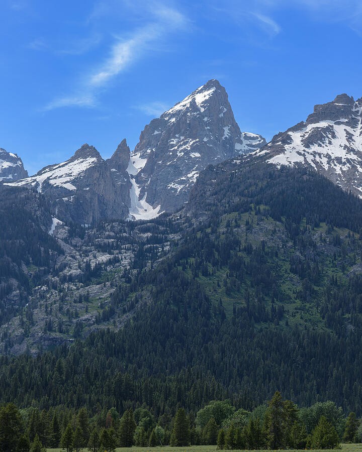 A Pointed Summit Beneath the Wispy Clouds
