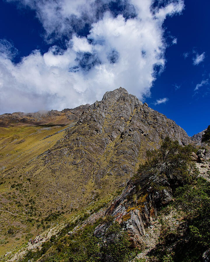 A Rocky Crest Above the Green Slope