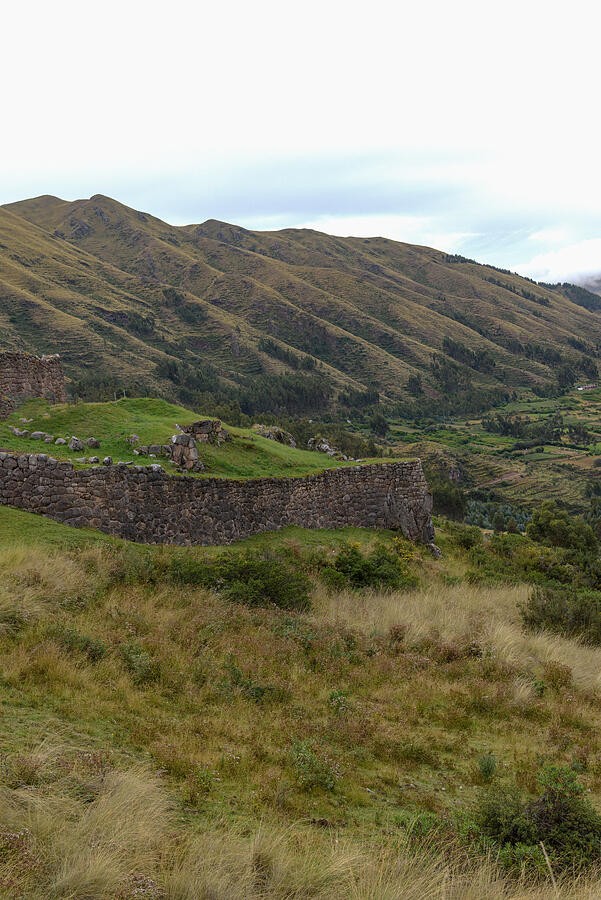 A Grassy Hillside Above the Stone Enclosure